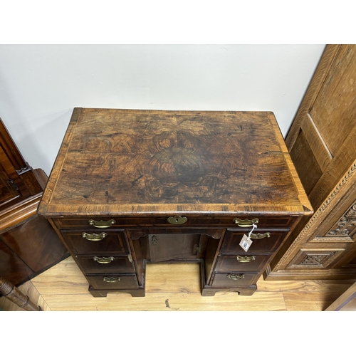 1154 - An 18th century banded walnut kneehole desk, width 80cm, depth 49cm, height 77cm