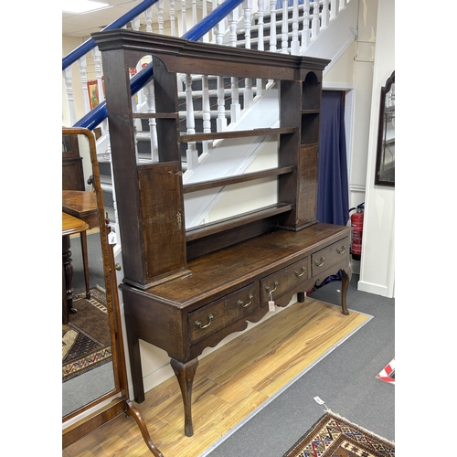 1160 - A George III mahogany banded oak dresser, with open rack, width 182cm, depth 48cm, height 195cm... 