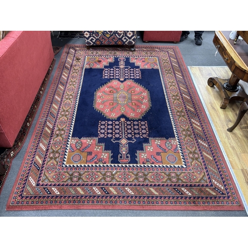 1165 - A North West Persian style machined blue ground carpet together with a similar runner, larger 295 x ... 