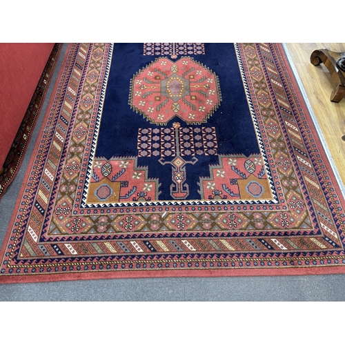 1165 - A North West Persian style machined blue ground carpet together with a similar runner, larger 295 x ... 