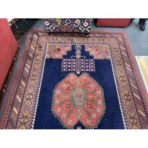 1165 - A North West Persian style machined blue ground carpet together with a similar runner, larger 295 x ... 