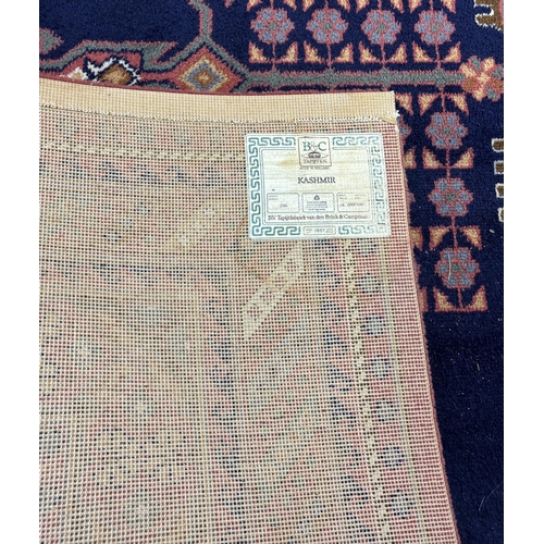 1165 - A North West Persian style machined blue ground carpet together with a similar runner, larger 295 x ... 