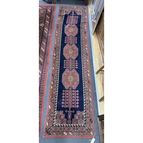 1165 - A North West Persian style machined blue ground carpet together with a similar runner, larger 295 x ... 