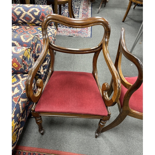 1170 - A set of six early Victorian rosewood dining chairs, two with arms