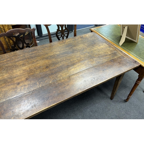 1182 - A 19th century rectangular Provincial oak kitchen table with cleated plank top, fitted two drawers o... 