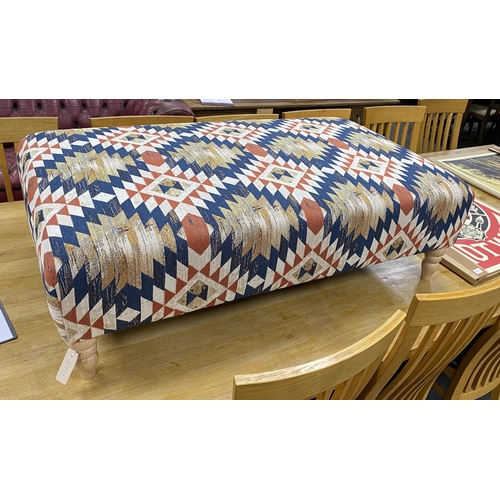 1188 - A large contemporary rectangular footstool upholstered in Kilim style polychrome fabric on turned be... 