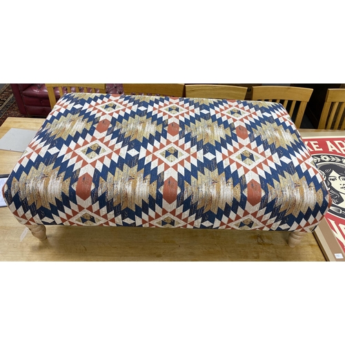 1188 - A large contemporary rectangular footstool upholstered in Kilim style polychrome fabric on turned be... 