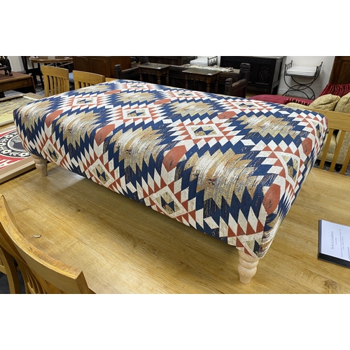 1188 - A large contemporary rectangular footstool upholstered in Kilim style polychrome fabric on turned be... 