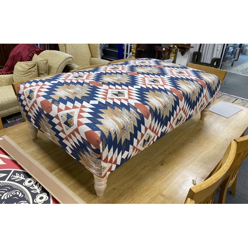 1188 - A large contemporary rectangular footstool upholstered in Kilim style polychrome fabric on turned be... 