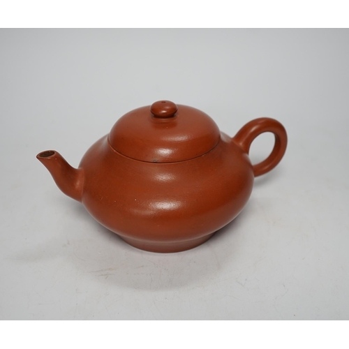 1255 - A 19th century Chinese Yixing teapot and cover, possibly for the Thai market, 9cm tall