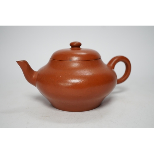 1255 - A 19th century Chinese Yixing teapot and cover, possibly for the Thai market, 9cm tall