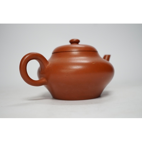 1255 - A 19th century Chinese Yixing teapot and cover, possibly for the Thai market, 9cm tall