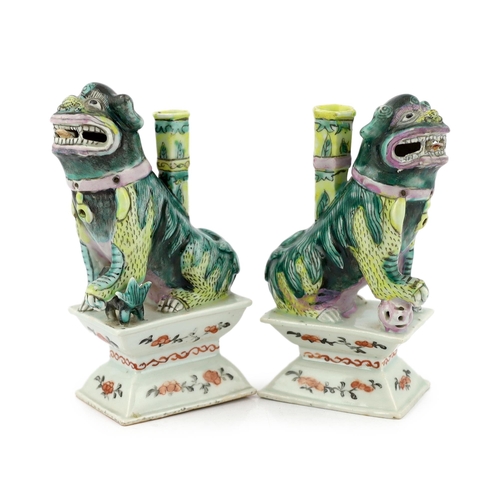 1265 - A pair of Chinese enamelled porcelain Buddhist lion joss stick holders, early 19th century, the li... 