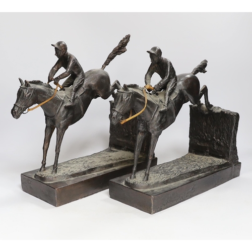 1279 - A pair of bronzed resin models of steeplechasers, 31cm