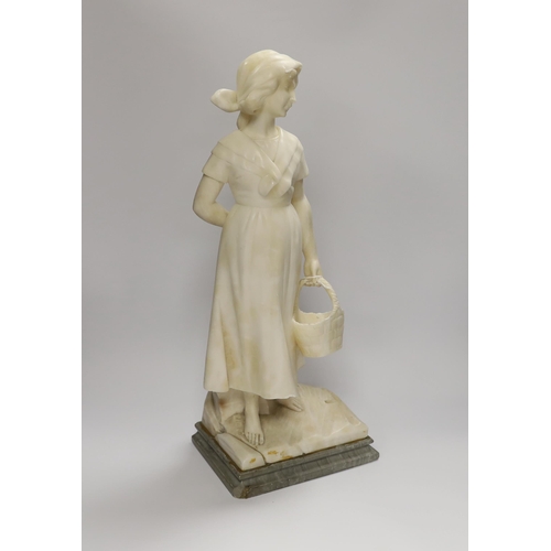 1283 - An alabaster carved figure of a girl holding a basket, 51cm high