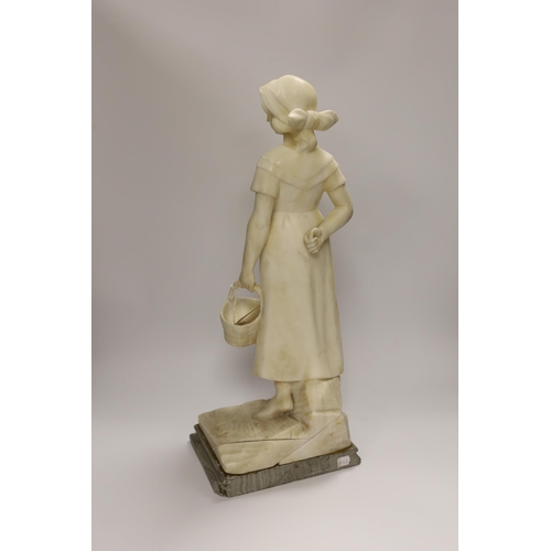 1283 - An alabaster carved figure of a girl holding a basket, 51cm high