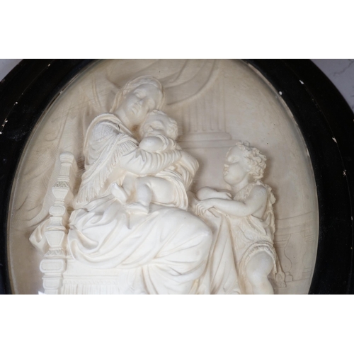 1288 - A pair of framed plaster ovals of the Madonna and Child with John the Baptist and the 'Descent from ... 