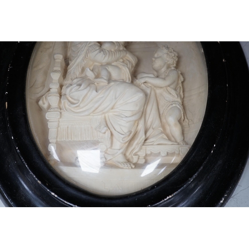 1288 - A pair of framed plaster ovals of the Madonna and Child with John the Baptist and the 'Descent from ... 