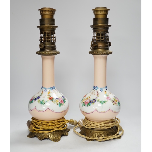 1293 - A pair of French brass mounted porcelain table lamps, 42cm