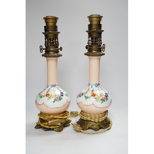 1293 - A pair of French brass mounted porcelain table lamps, 42cm