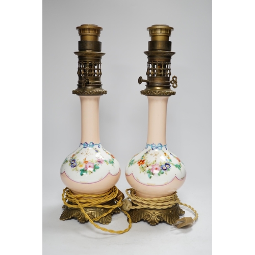 1293 - A pair of French brass mounted porcelain table lamps, 42cm