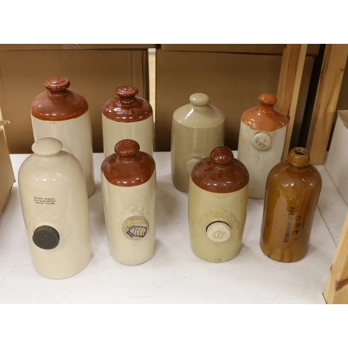 1300 - Eight various stoneware hotwater bottles, early 20th century, largest 30cm high