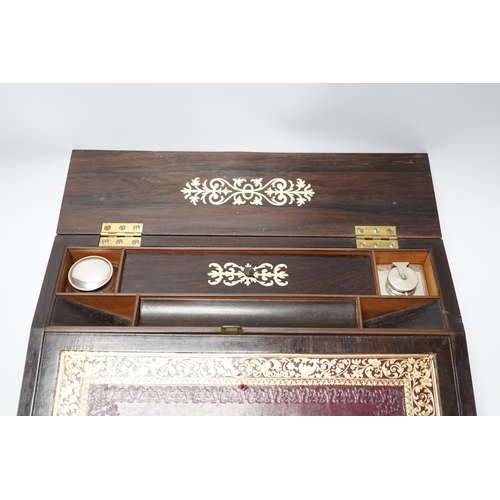 1309 - An early Victorian fret cut ivory inlaid rosewood writing slope with tooled leather slope, 35cm wide... 