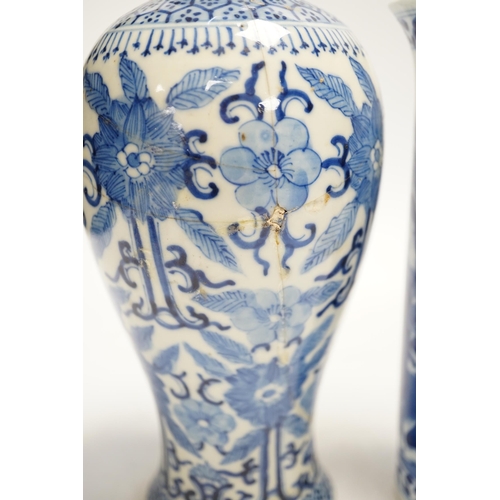 1323 - Two early 20th century Chinese blue and white vases, one restored, 23cm