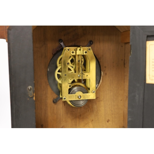 1355 - A carved wood clock with barometer, thermometer and compass, 52cm high