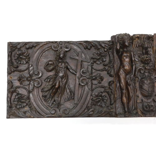 1357 - A 17th century French carved walnut triptych panel, formed from several associated sections, with ce... 