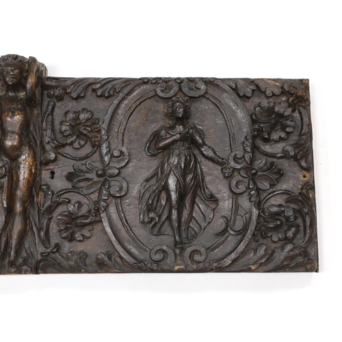 1357 - A 17th century French carved walnut triptych panel, formed from several associated sections, with ce... 