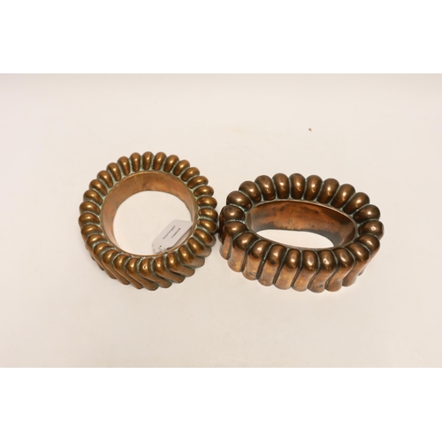 1420 - Two Victorian copper jelly moulds, the ring shaped example stamped Baileys hotel and the overall exa... 