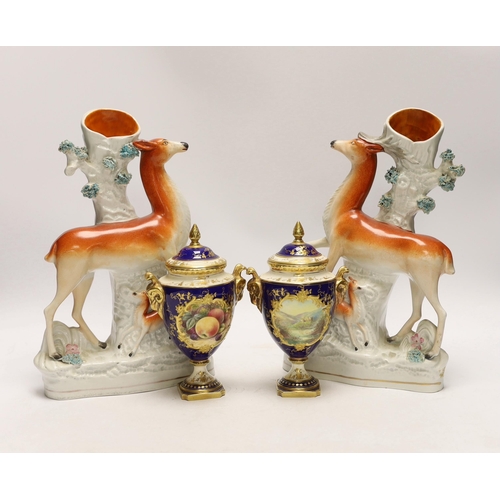 1422 - A pair of Coalport vases and covers and a pair of Staffordshire deer spill vases, largest 29cm high... 