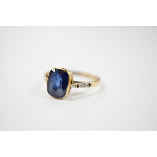 1958 - A yellow metal and single stone synthetic sapphire set ring, with rose cut diamond chip set shoulder... 