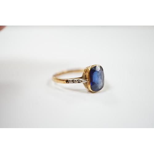 1958 - A yellow metal and single stone synthetic sapphire set ring, with rose cut diamond chip set shoulder... 