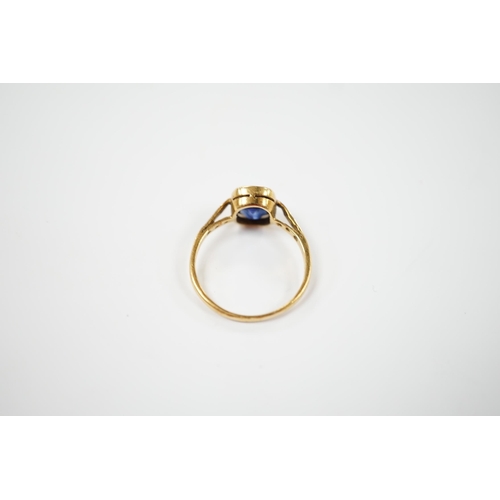 1958 - A yellow metal and single stone synthetic sapphire set ring, with rose cut diamond chip set shoulder... 