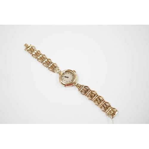 1959 - A lady's early to mid 20th century 9ct gold manual wind wrist watch(a.f.), on a yellow metal bracele... 