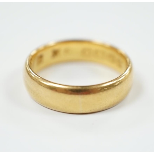 1960 - A 22ct. gold wedding band, size N, 7.2 grams.