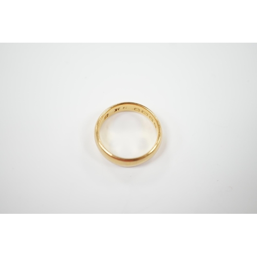 1960 - A 22ct. gold wedding band, size N, 7.2 grams.