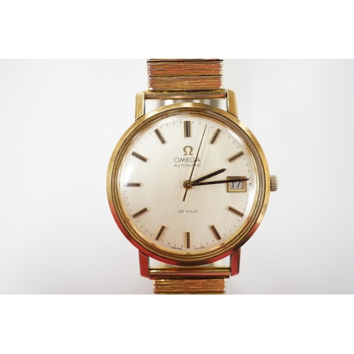 1988 - A gentleman's yellow metal Omega De Ville automatic wrist watch, with baton numerals and date apertu... 