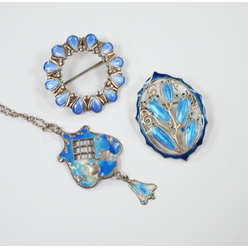 1990 - A George V silver and enamel set drop pendant (a.f.), 40mm on a white metal chain and two white meta... 