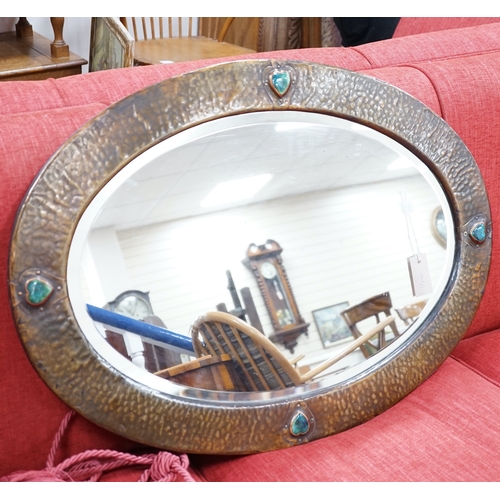 1189 - An Arts and Crafts style hammered copper mirror