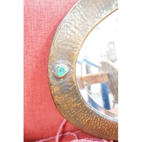 1189 - An Arts and Crafts style hammered copper mirror