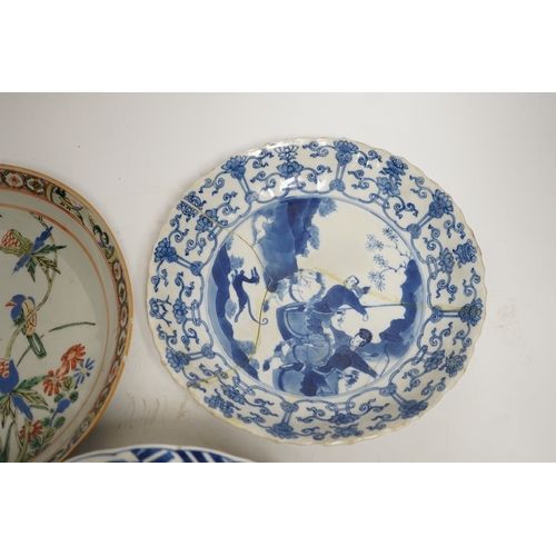 1282 - A Chinese blue and white warriors bowl, Kangxi mark and period, a similar hunting saucer dish, a... 