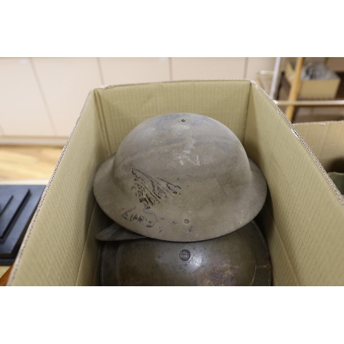 Six military etc. tin helmets. Including an example, painted as an Air ...