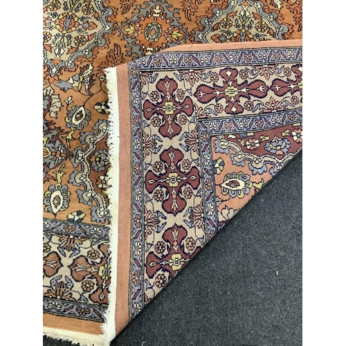 30 - A North West Persian style pale red ground carpet, 250 x 154cm