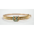 A 9ct gold, seed pearl and turquoise set twin horseshoe motif hinged ...