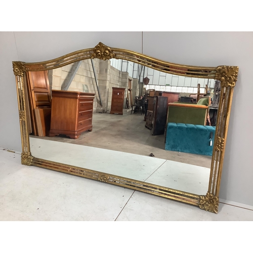 1014 - A large Victorian style gilt framed overmantel mirror, width 184cm, height 112cm