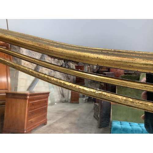 1014 - A large Victorian style gilt framed overmantel mirror, width 184cm, height 112cm