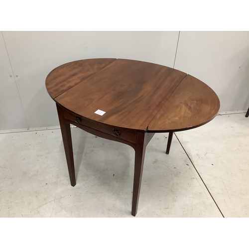 1036 - A small George III inlaid mahogany oval Pembroke table, width 71cm, depth 49cm, height 66cm